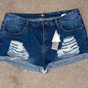 Distressed mid rise denim shorts